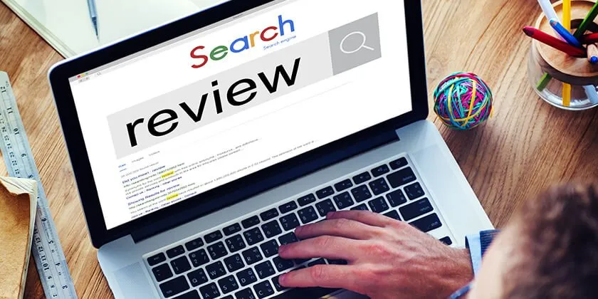 Man Using Laptop To Search — Haslet, TX — Super Roofman